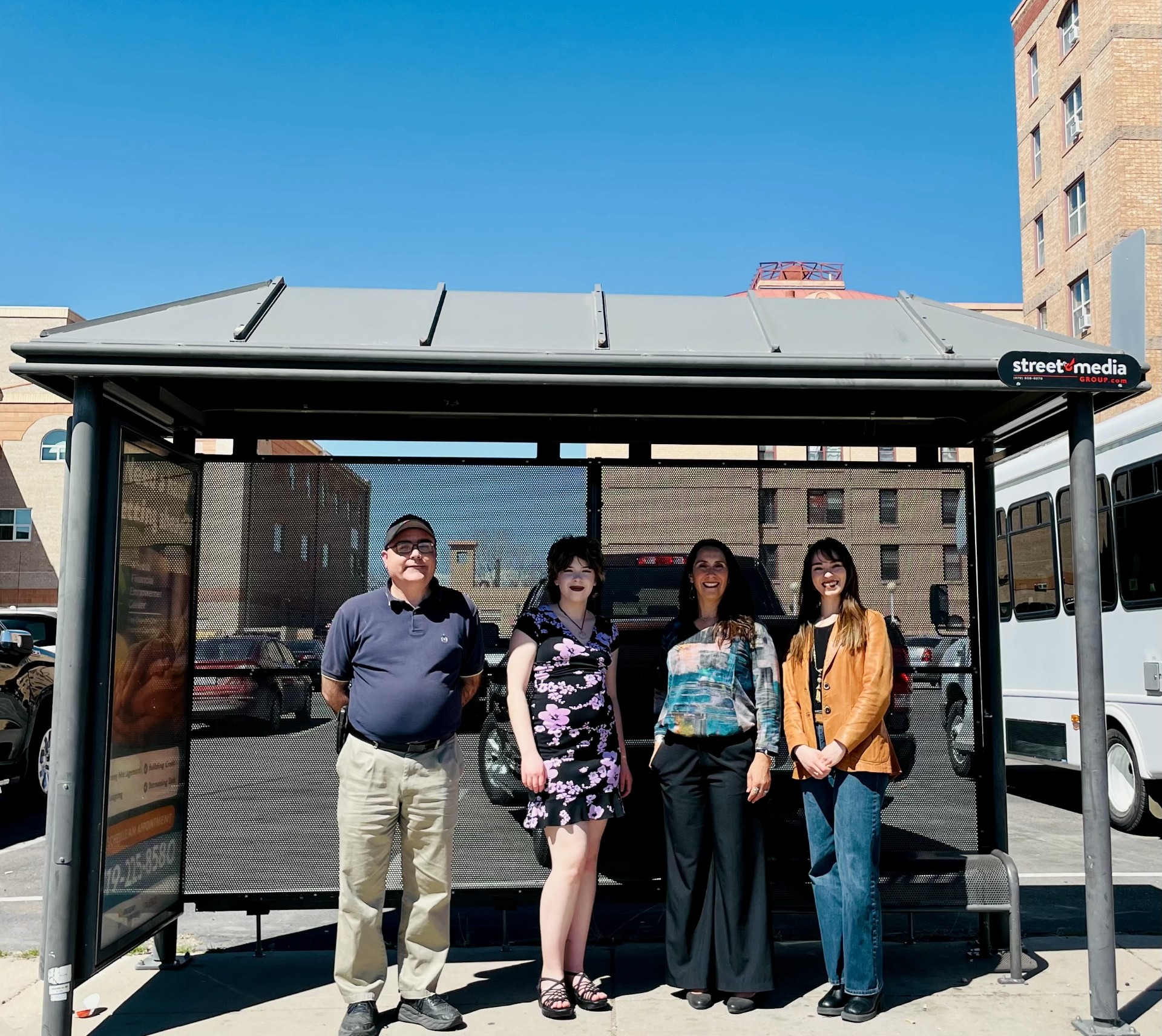 Community Spaces strategy team at a bus stop that will be part of beautification